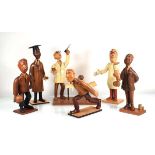 A group of six 1950's Italian carved figures by Romer including two doctors, two bowlers, a school