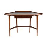 A 1960's walnut and tooled leather corner writing table with a single drawer, brass handles,