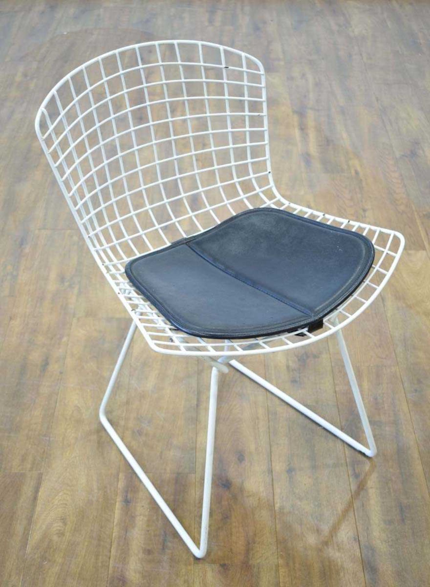 After Harry Bertoia, a 1960's 420-style side chair, enamelled in white, with a black padded seat * - Image 2 of 2