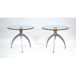 A pair of Atomic or Sputnik style side tables, the glass surfaces connected to beech and aluminium