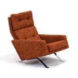A 1960's 'Leo' armchair by Robin Day upholstered in a rust brown check on chromed angular legs *