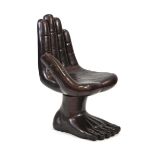 A 1970's resin and fibreglass swivel chair modelled as a hand and foot, in a gunmetal finish,