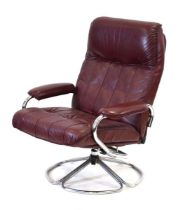 A 1970's Danish swivel and reclining armchair on a chromed base *Sold subject to our Soft