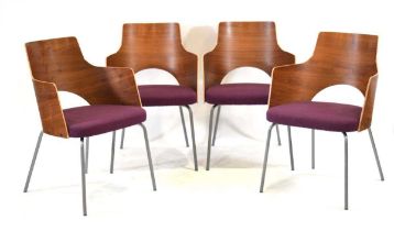 A set of four Gunilla Allard 'Cortina' armchairs with walnut shells and purple upholstered seats,