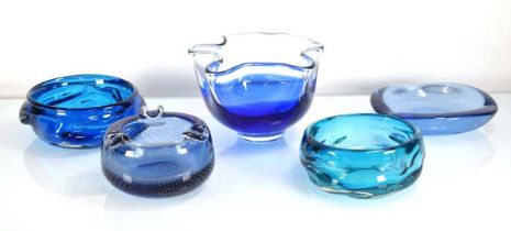 A group of four magna blue and aqua glass bowls and ashtrays including two by Whitefriars,