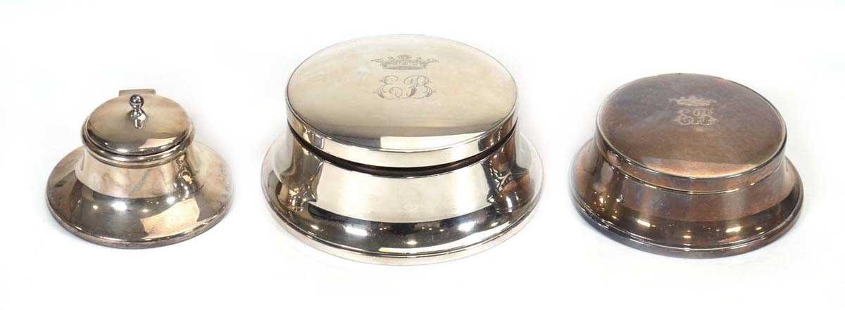 A mid 20th century silver capstan type inkwell, S&M, Birmingham 1949, d. 12 cm and two similar