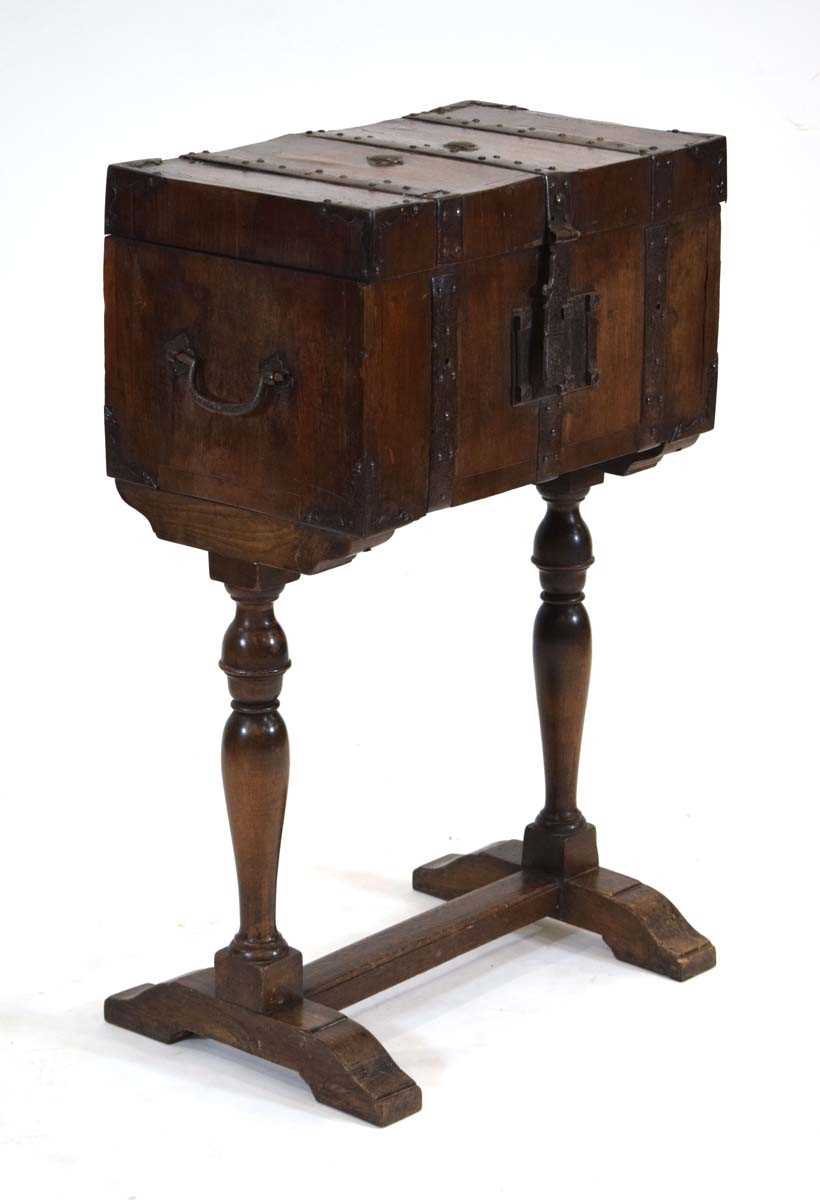 A walnut and metalwork mounted stagecoach strong box with a teak lining, on a later oak standh. 89