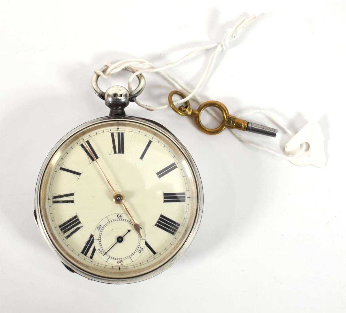 A late 19th century silver open face pocket watch, the white enamel dial with black Roman numerals