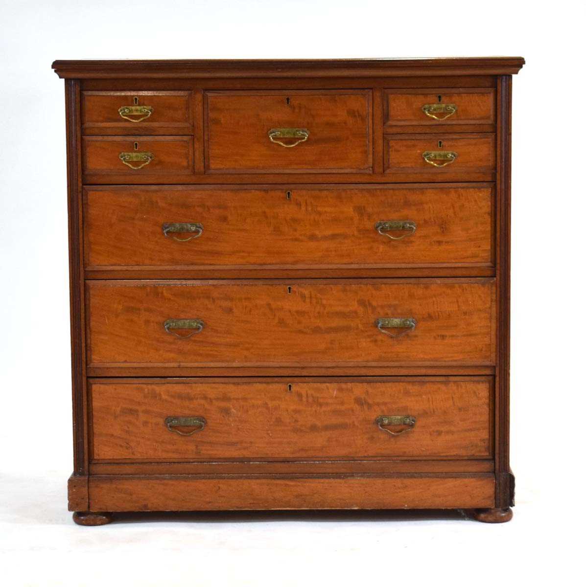 A late 19th century mahogany chest of eight drawers by James Shoolbred & Co., on a plinth base, - Image 2 of 3