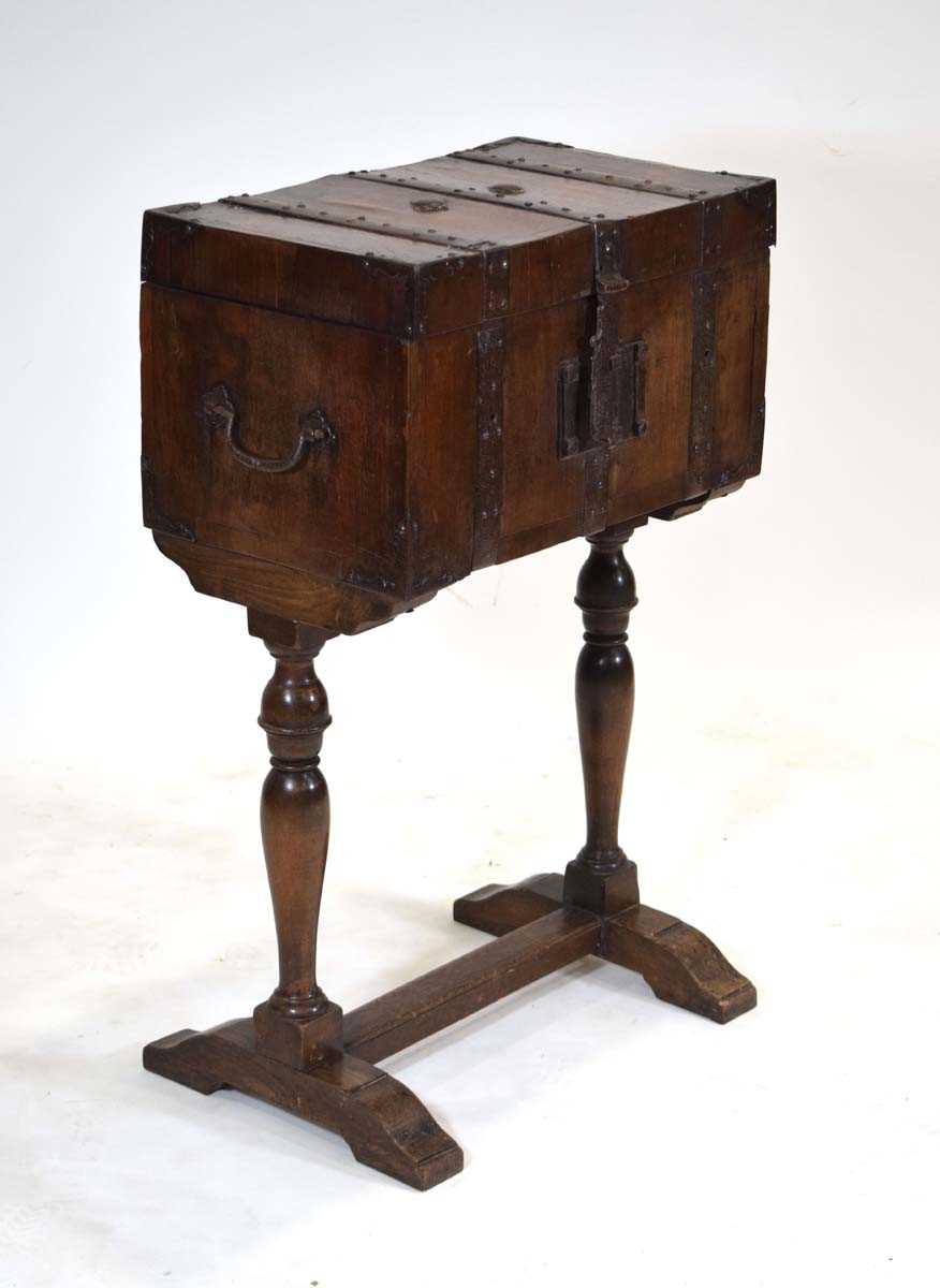 A walnut and metalwork mounted stagecoach strong box with a teak lining, on a later oak standh. 89 - Image 2 of 5