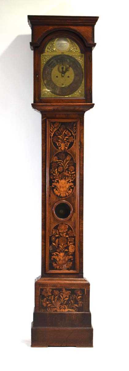 An early 18th century and later longcase clock, the movement striking on a bell, the brass face with