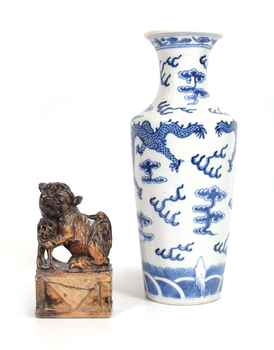 A Chinese blue and white vase decorated with a dragon amidst clouds, Kangxi mark, h. 25 cm, together