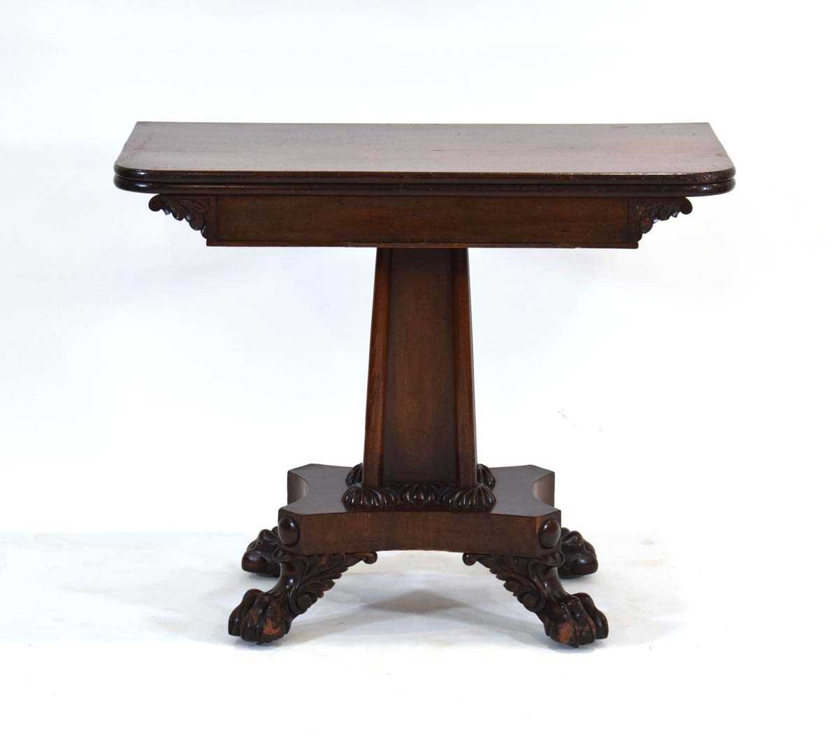 A 19th century mahogany fold-over tea table on a shaped column, platform base and claw feet, w. 91