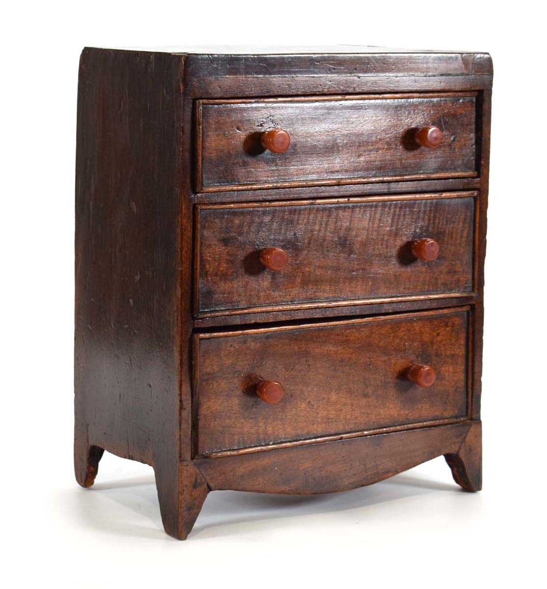 An apprentice piece modelled as a Victorian mahogany chest of three drawers, 24 x 16 x 31 cm