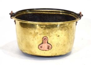 A 19th century brass and copper mounted preserving pot with a swing handle, d. 44 cm