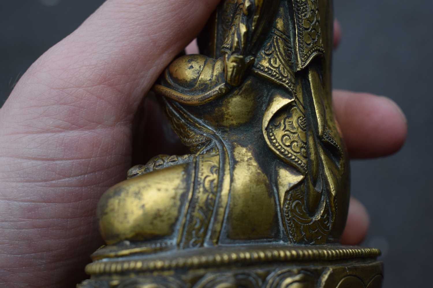 A 19th century Tibetan gilt bronze figure modelled as Tsongkhapa, h. 18 cmSome tarnishing. Base - Image 19 of 28