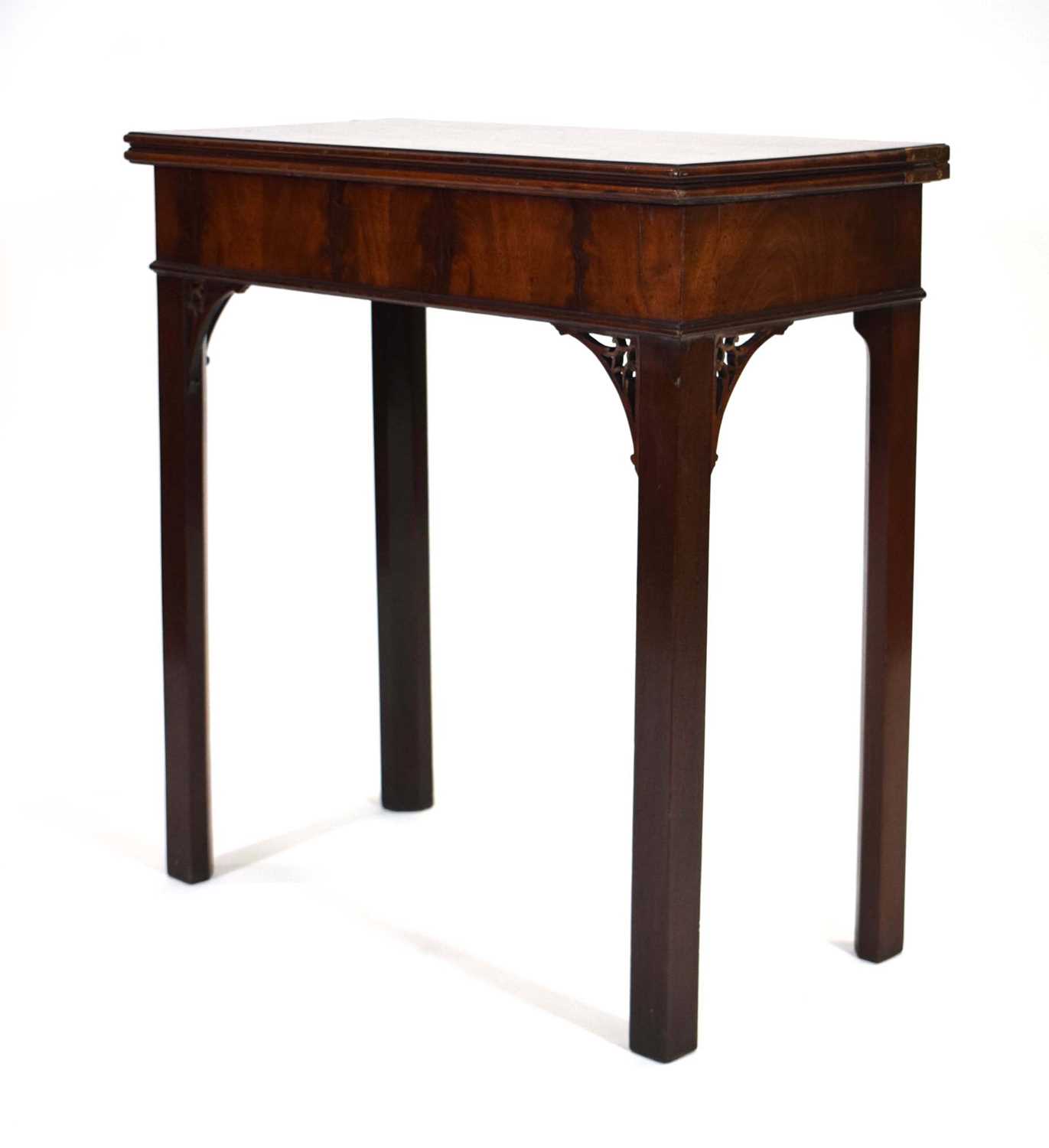 A George III mahogany tea table, the rectangular canted folding surface on square straight legs with