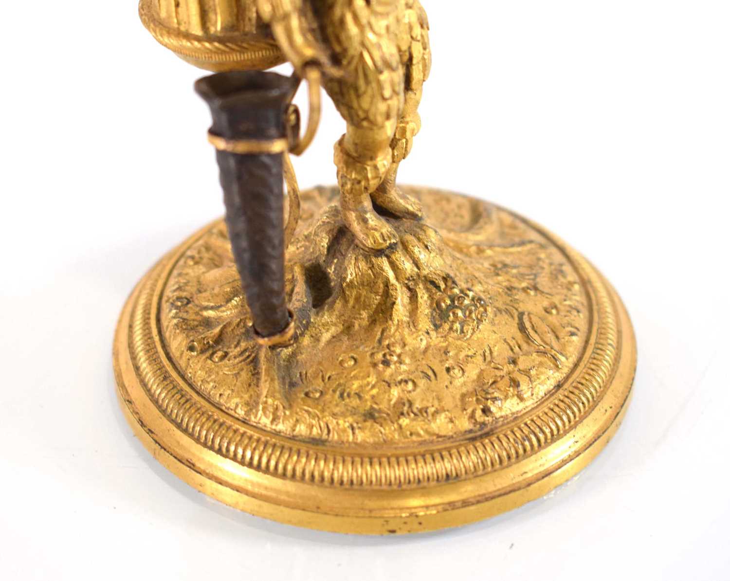An early 20th century gilt bronze candle holder and vesta modelled as a boy clad in feathers, - Image 3 of 5
