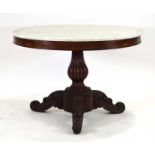 A mid-19th century French centre table, the circular grooved marble surface resting on a mahogany
