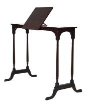 An early 20th century mahogany mobile writing table with an adjustable slope and ratchet