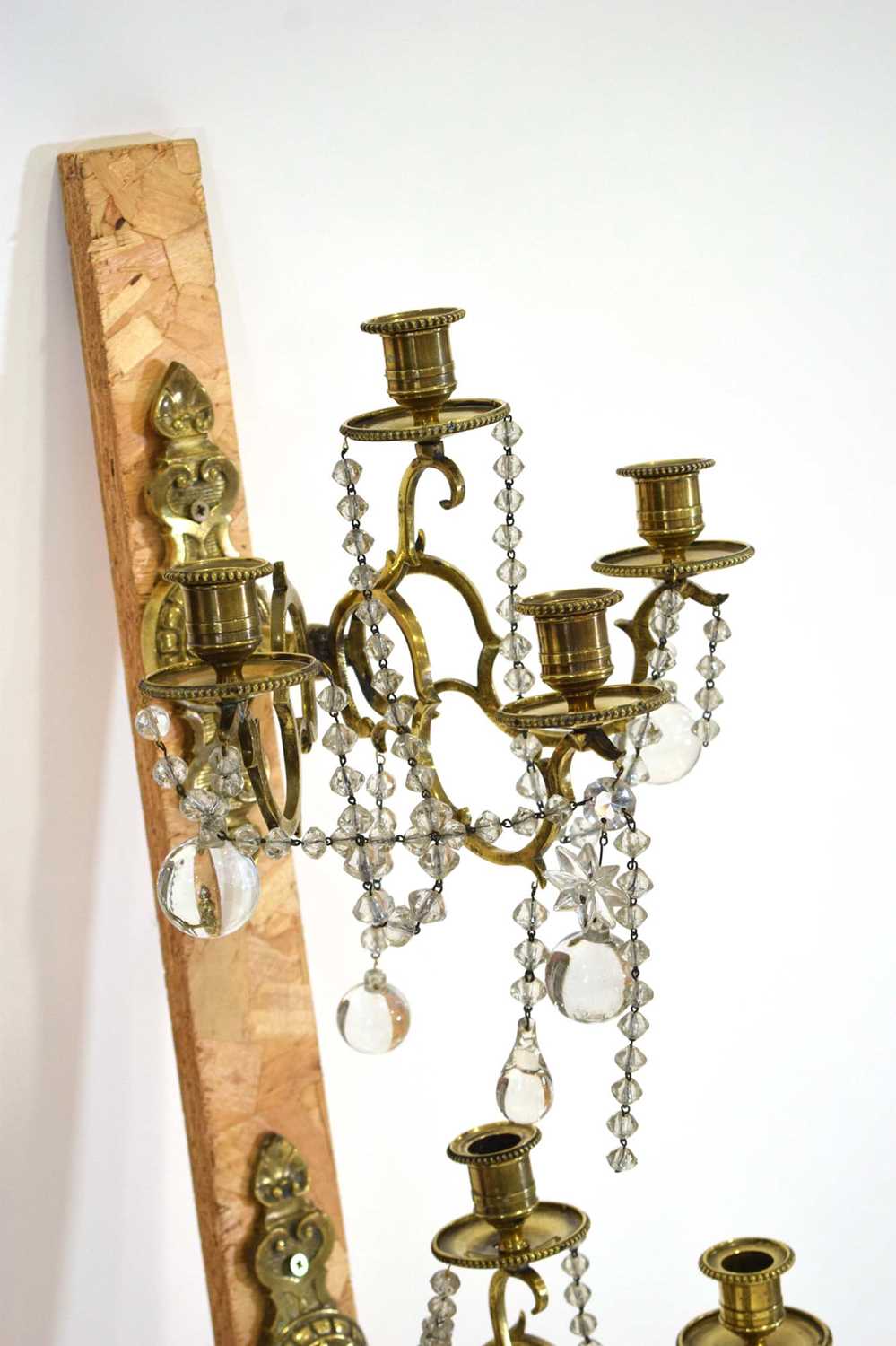 A set of four 20th century brasswork wall sconces with glass lustre droplets, on a pair of watered - Image 2 of 3