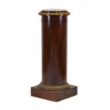 A late 19th century mahogany and gilt metal mounted column or torchiere on a plinth base, h. 112 cm,