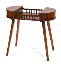 A late 20th century ladies work table in yew, the pair of D-end lifting lids joined by a galleried
