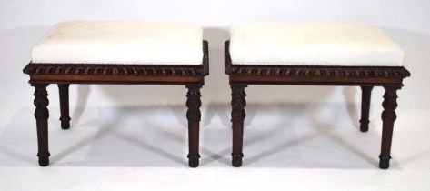 A pair of mid-19th century mahogany stools with gadrooned borders and turned legs with knot carving,