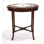 A 19th century ceramic turkey drainer, 34 x 25 cm, inset into a bespoke 20th century mahogany table,