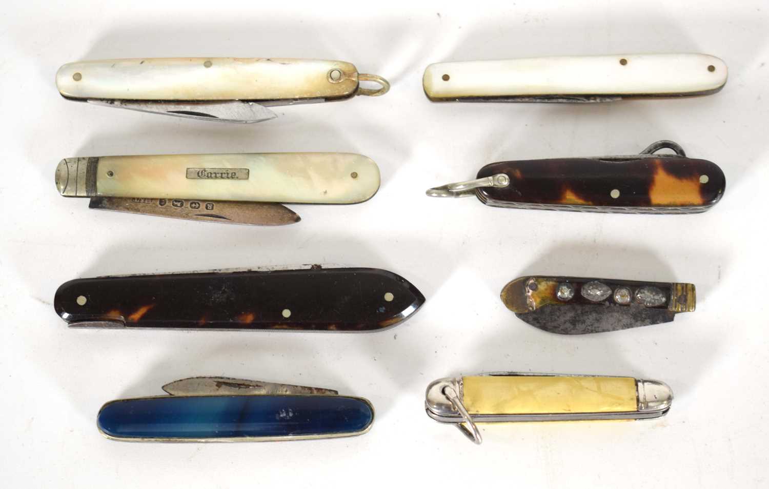 A group of eight pocket knives including mother-of-pearl, faux tortoiseshell and other examples (8)