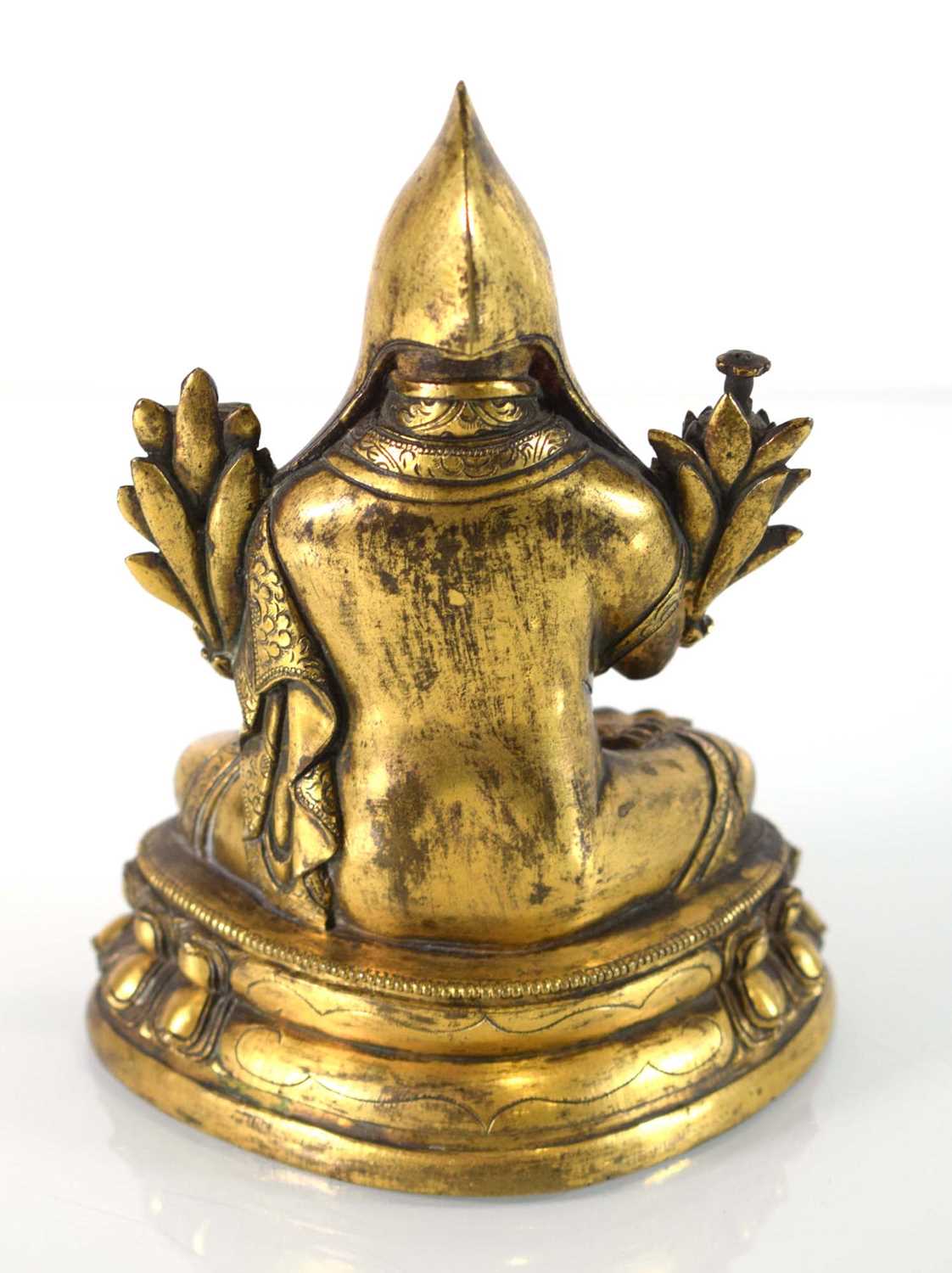 A 19th century Tibetan gilt bronze figure modelled as Tsongkhapa, h. 18 cmSome tarnishing. Base - Image 2 of 28