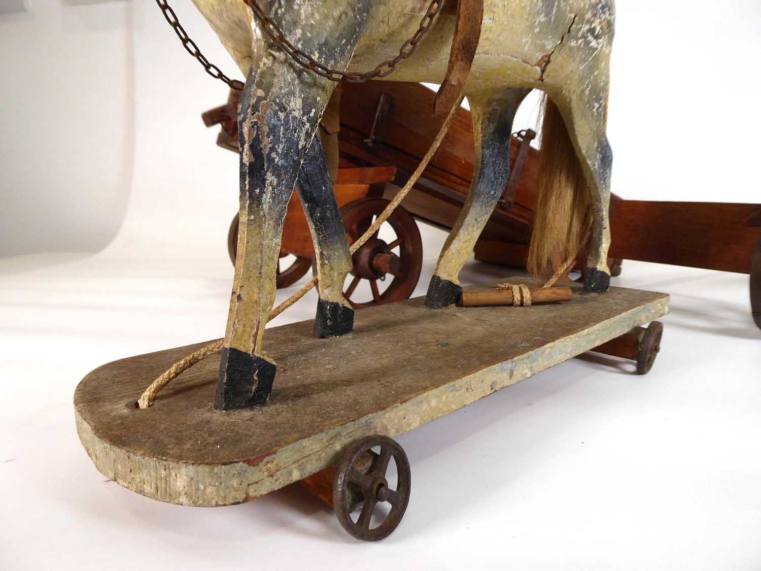 A late 19th/early 20th century painted pine pull along horse, l. 31 cm and an associated cart (2) - Image 7 of 8