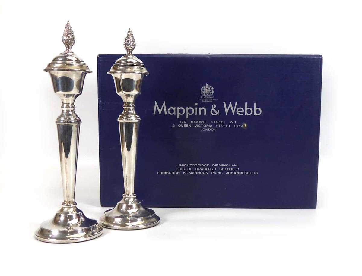 A pair of late 20th century silver candlesticks of classical form removable foliate finials, with