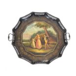 A 20th century tole piercework tray decorated with a classical landscape depicting a dandy and his