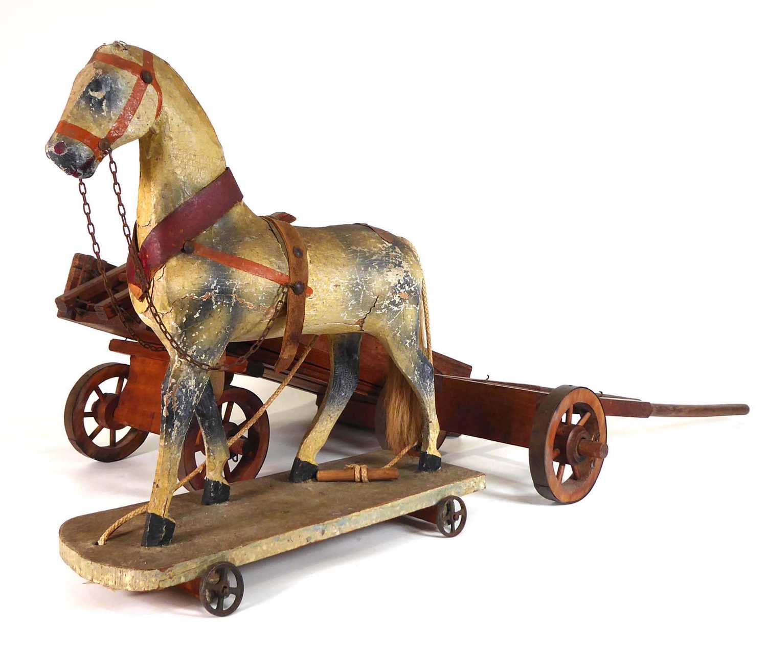 A late 19th/early 20th century painted pine pull along horse, l. 31 cm and an associated cart (2)