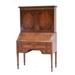 A George III mahogany, ebony and marquetry strung bureau cabinet, the two panelled doors below