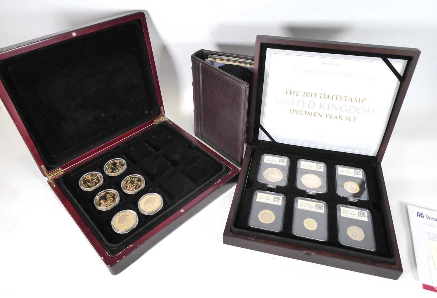 A large group of collectable coins including a Gringotts savings book, a set of Morgan Mint Elvis