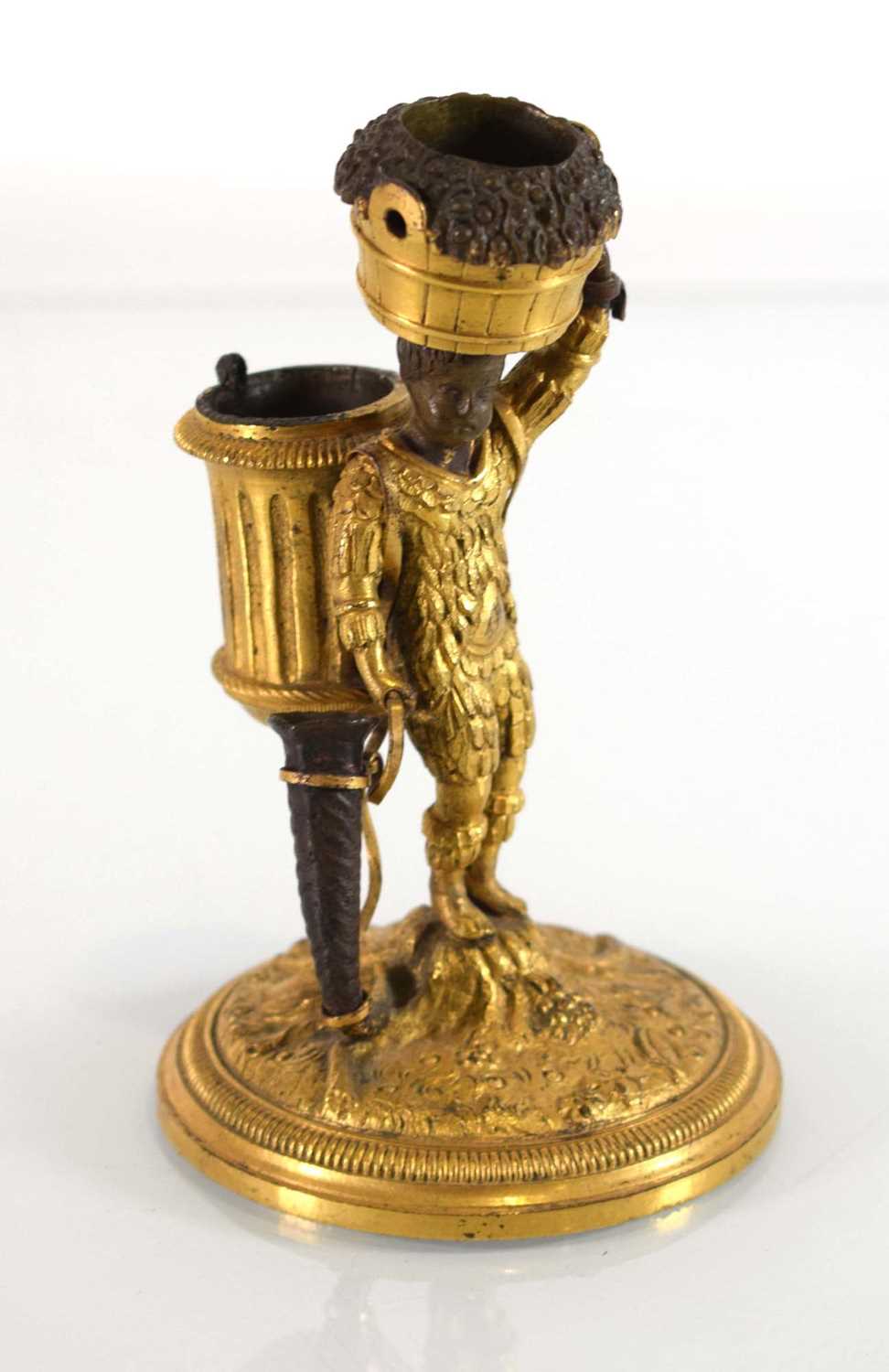 An early 20th century gilt bronze candle holder and vesta modelled as a boy clad in feathers, - Image 2 of 5