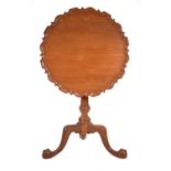 A late 20th century beech tilt-top table in the George II/III manner, the pie-crust surface on a