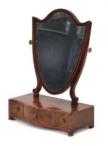 A Victorian mahogany and walnut crossbanded toilet mirror with a shield-shaped back over a