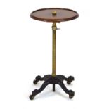 A Victorian occasional table, the mahogany galleried surface on an adjustable brass stem and cast