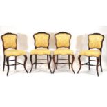 A set of four 19th century rosewood and gold upholstered parlour or dining chairs with cabriole