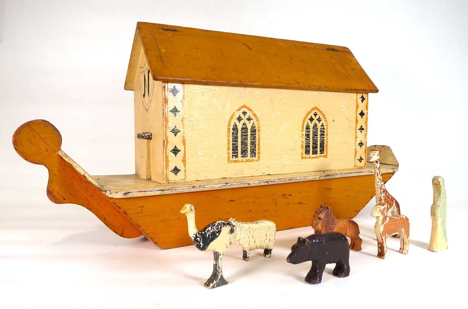 A late 19th/early 20th century Noah's Ark, l. 65 cm and a collection of painted wooden animals (