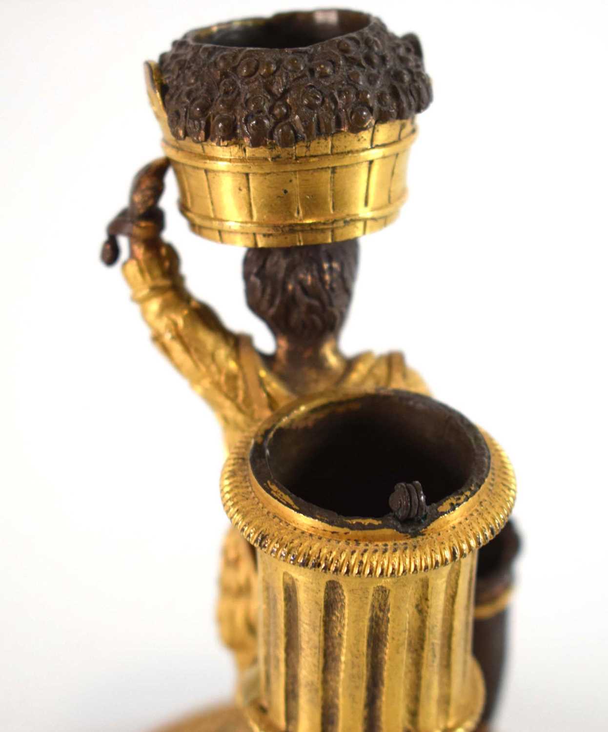 An early 20th century gilt bronze candle holder and vesta modelled as a boy clad in feathers, - Image 4 of 5