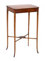A Sheraton Revival satinwood and strung sewing table, the lift-lid enclosing a fitted interior, on