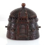 A 19th century carved tobacco box modelled as a fortress inscribed 'Feu' and dated 1863, w. 11 cm,