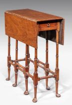 A George III style mahogany 'Spider Leg' table, the drop-leaf surface over a single frieze drawer on