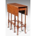 A George III style mahogany 'Spider Leg' table, the drop-leaf surface over a single frieze drawer on