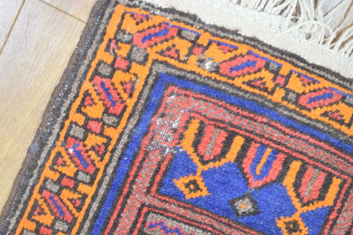 A mid-20th century woollen prayer rug, the blue ground with orange and red architectural motifs, 149 - Image 2 of 4