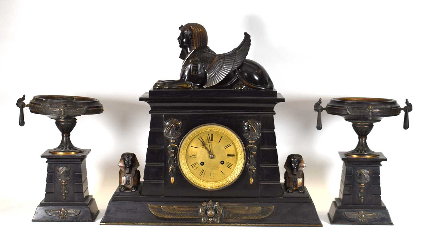 A Victorian 'Egyptian Revival' mantle clock and garnitures, the slate and marble body surmounted and - Image 2 of 4